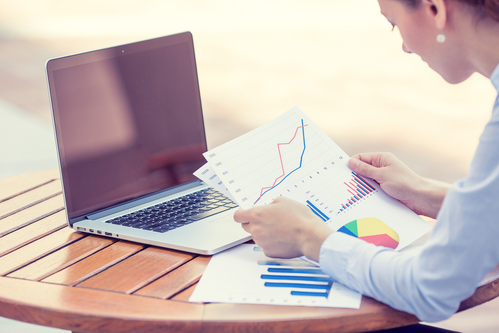 man reviewing analytical and accounting reports